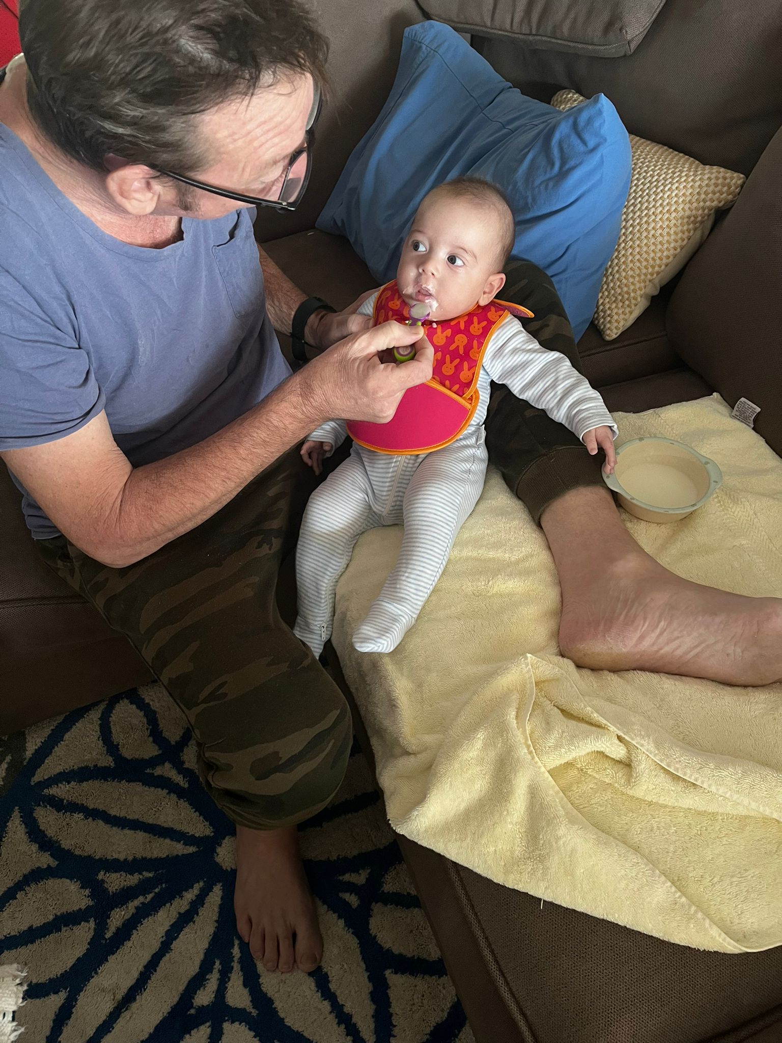 Michael feeding baby Oscar