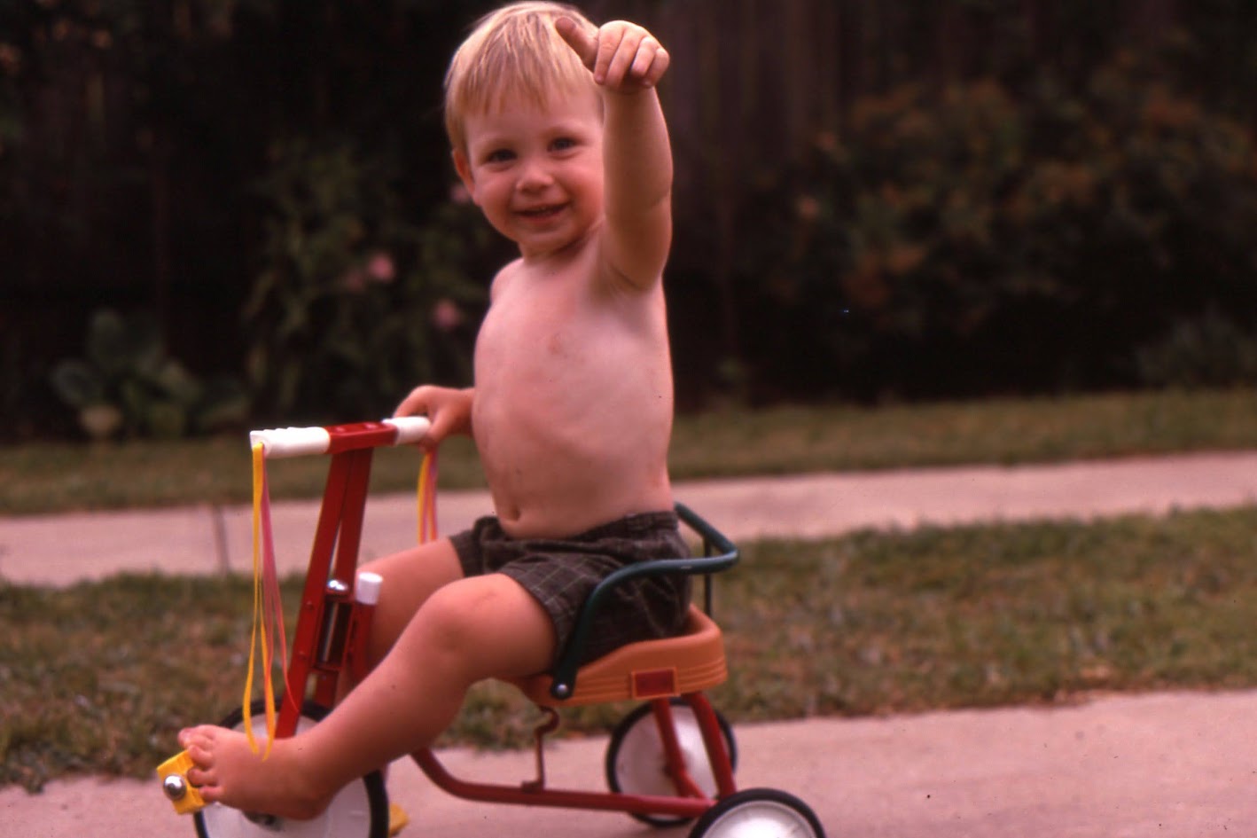 a young Michael on his tricycle at Blacktown
