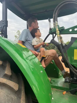 Michael with Oscar on tractor
