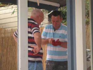 Michael & Ken shucking oysters Christmas at Willoughby.